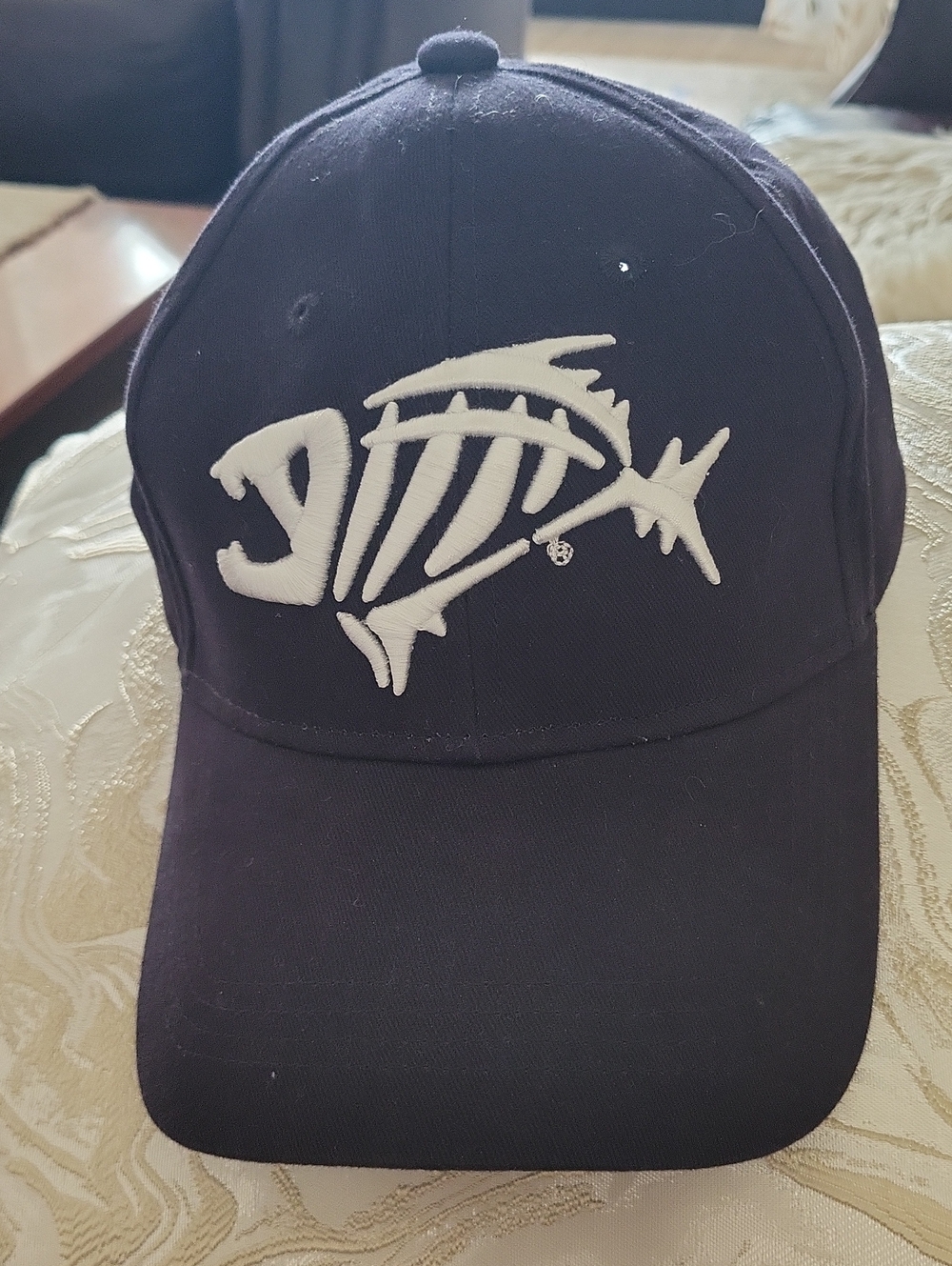 Black Baseball Cap with White Fish Skeleton Logo